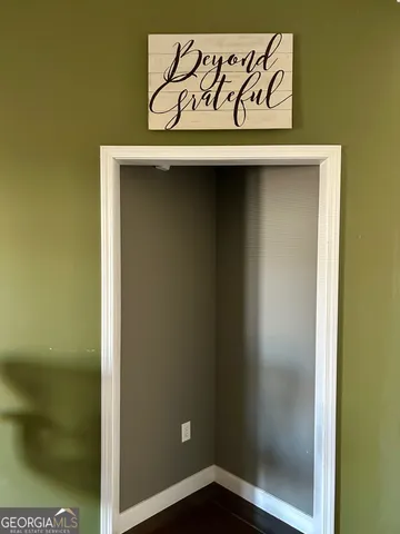 a view of front door with wooden floor