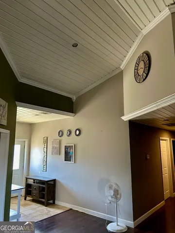 a view of workspace with furniture and a ceiling fan