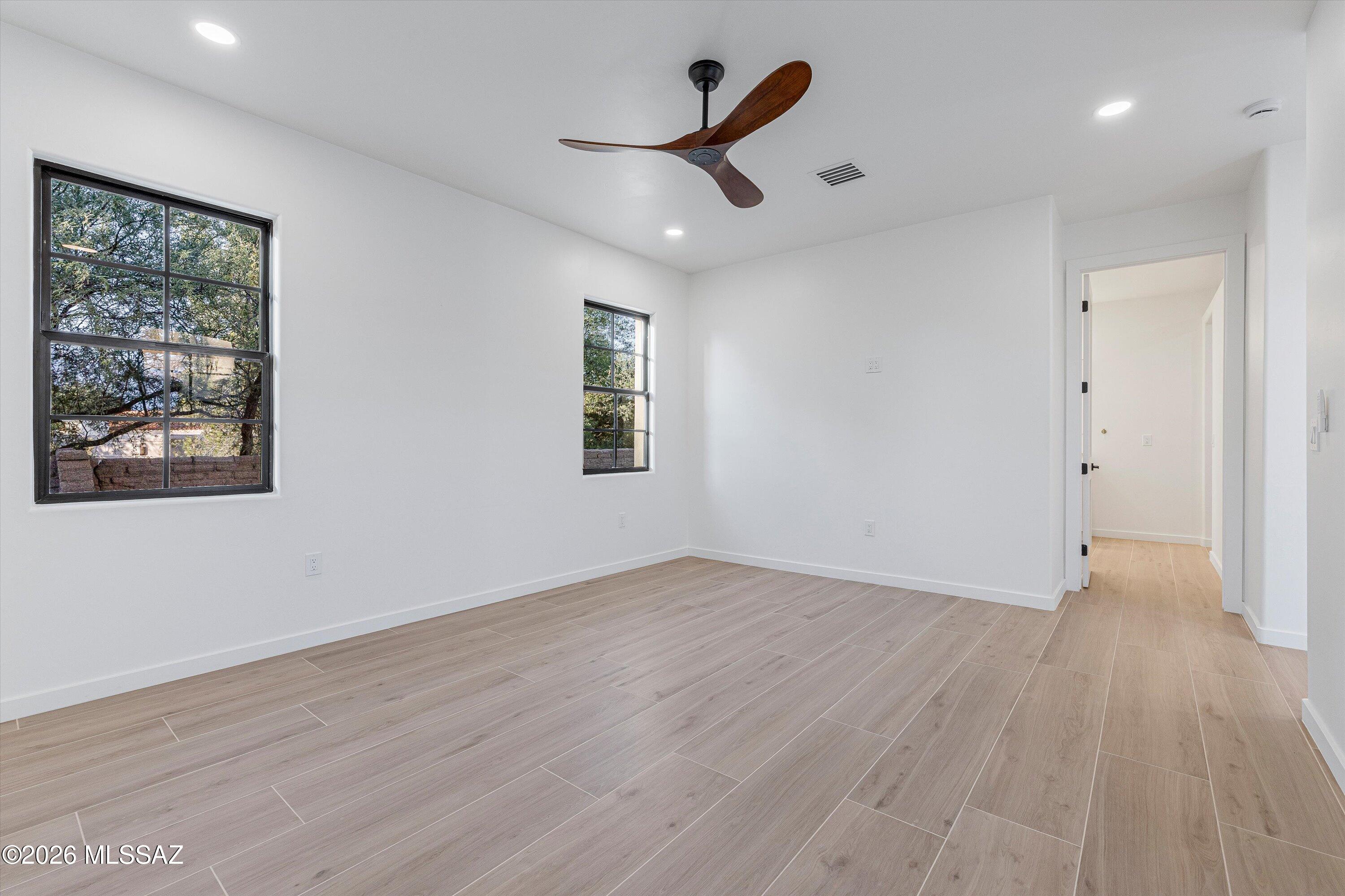 5259 East Fort Lowell Road Tucson, AZ 85712 - Photo 23 of 50 a view of empty room with wooden floor and window