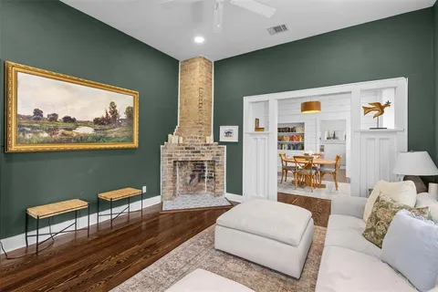 a living room with furniture and a painting