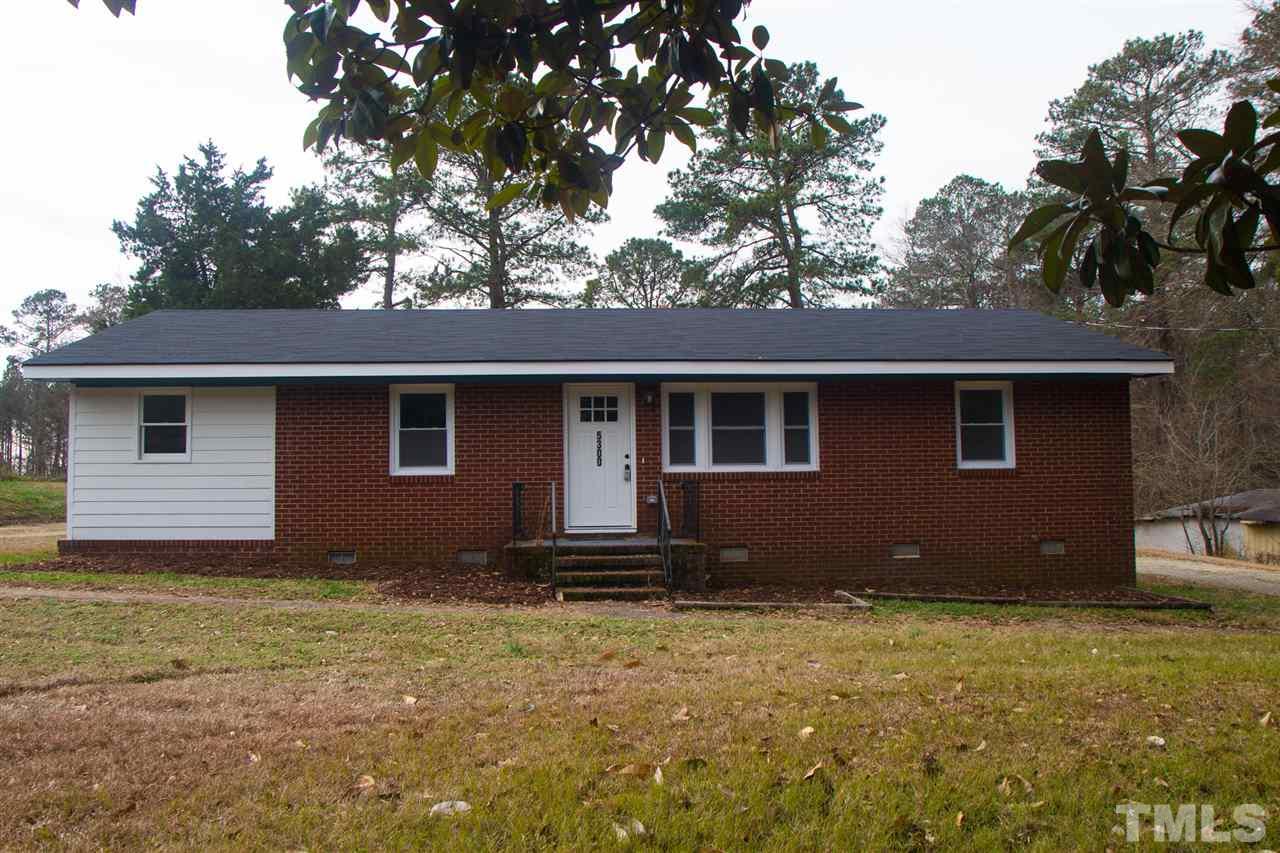 5300 Rock Quarry Road Raleigh, NC 27610 - Photo 1 of 19 a house that has a tree in front of it