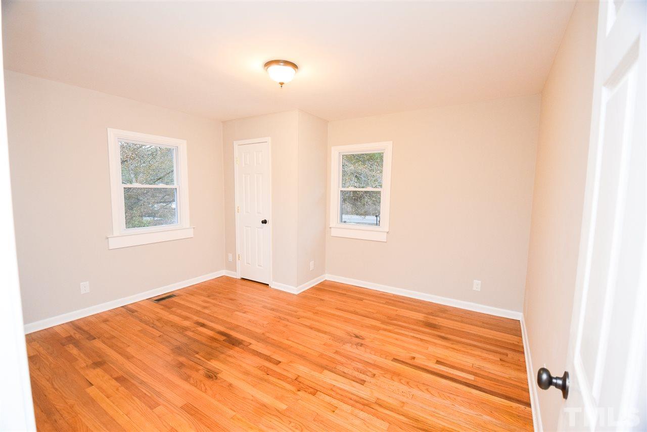 5300 Rock Quarry Road Raleigh, NC 27610 - Photo 12 of 19 a bedroom with a bed and a window