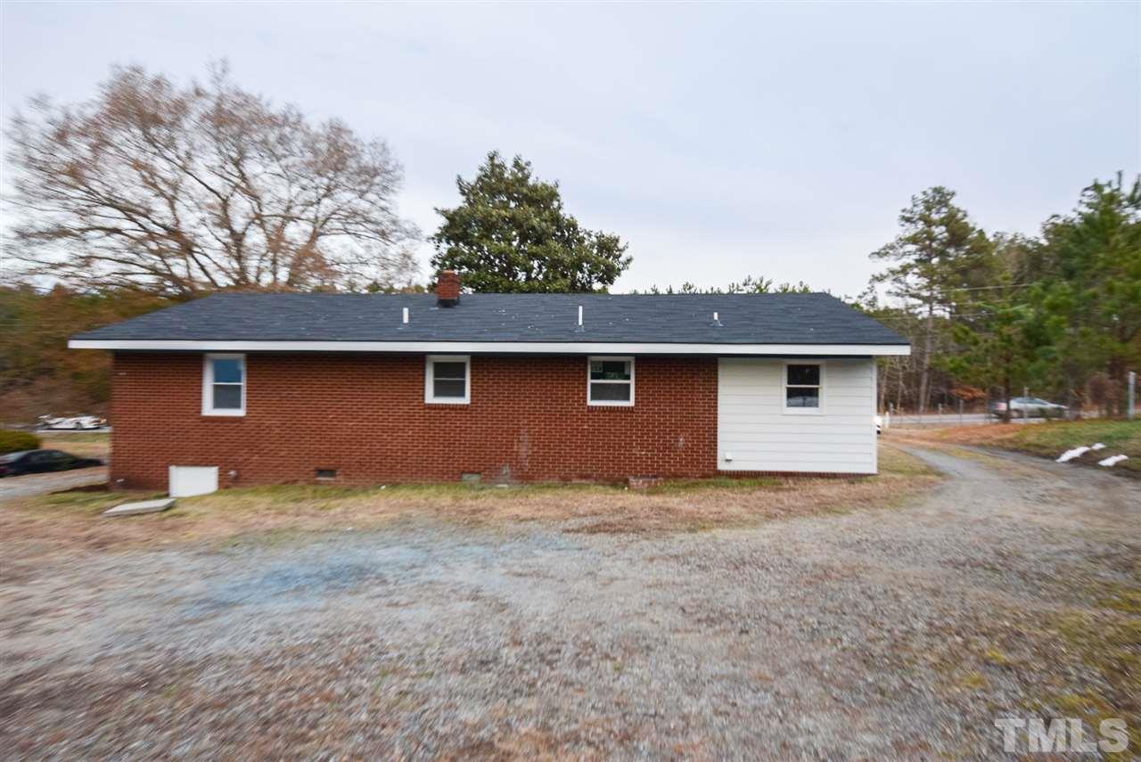 5300 Rock Quarry Road Raleigh, NC 27610 - Photo 17 of 19 a front view of a house with yard