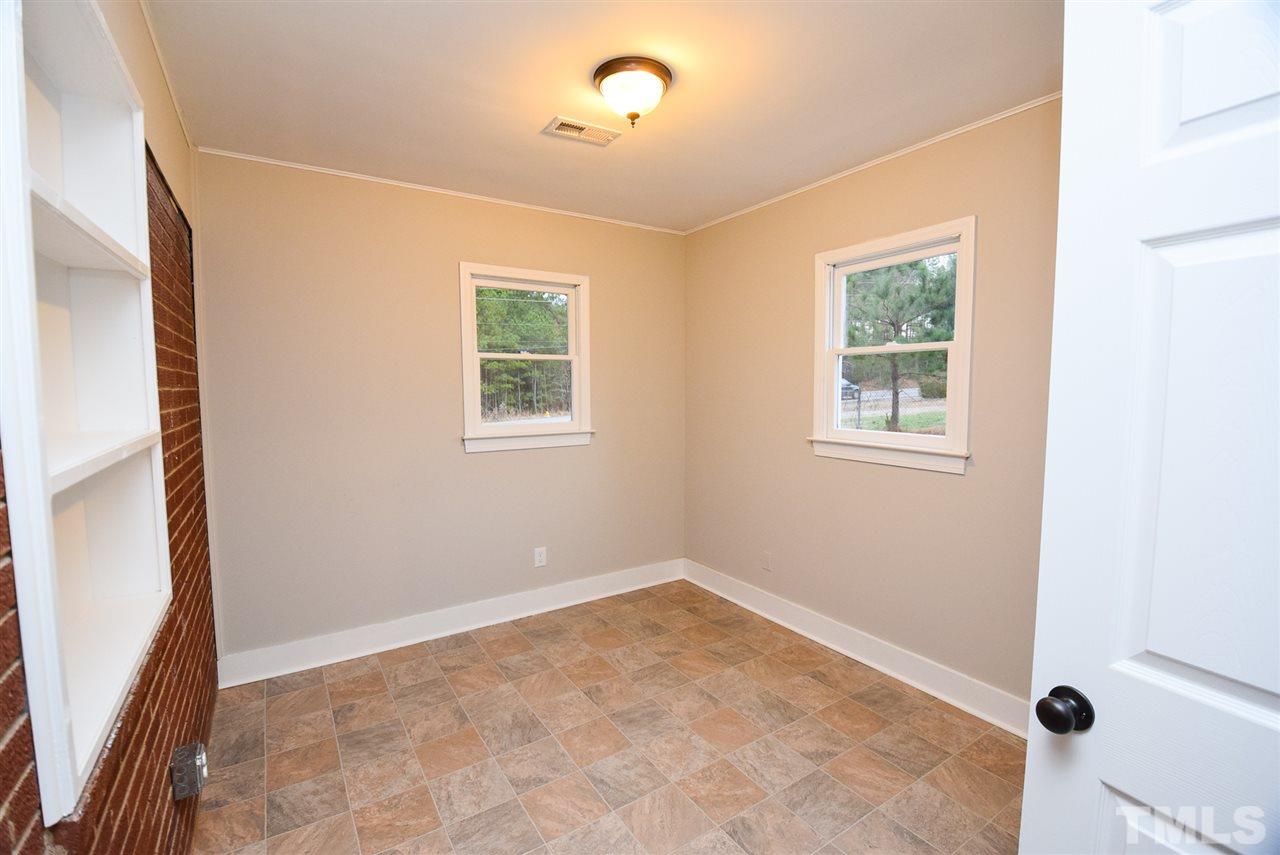 5300 Rock Quarry Road Raleigh, NC 27610 - Photo 3 of 19 an empty room with windows