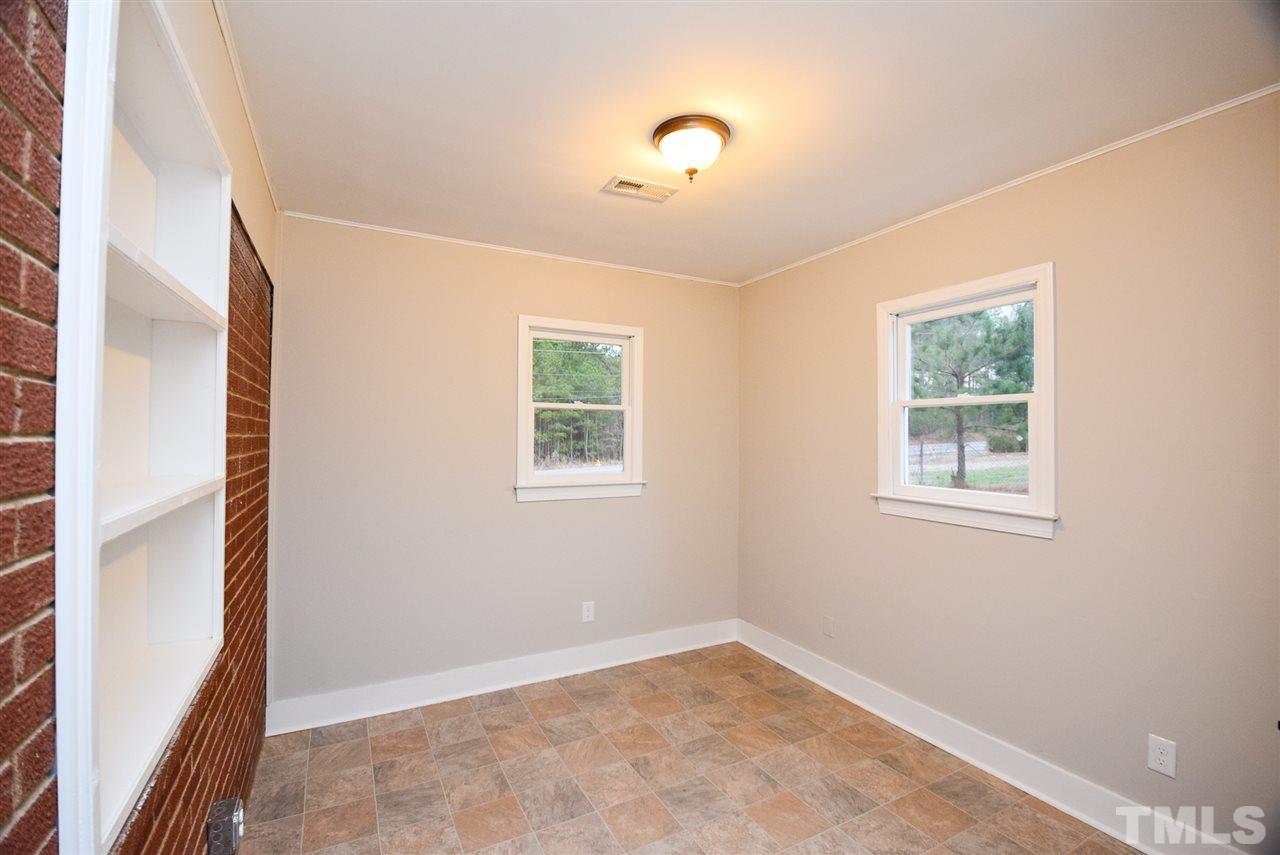 5300 Rock Quarry Road Raleigh, NC 27610 - Photo 4 of 19 an empty room with windows