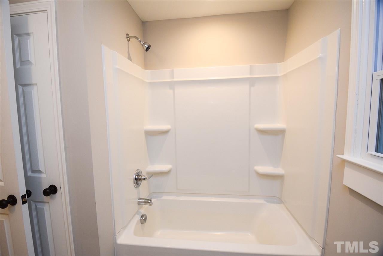 5300 Rock Quarry Road Raleigh, NC 27610 - Photo 10 of 19 a bathroom with a bathtub