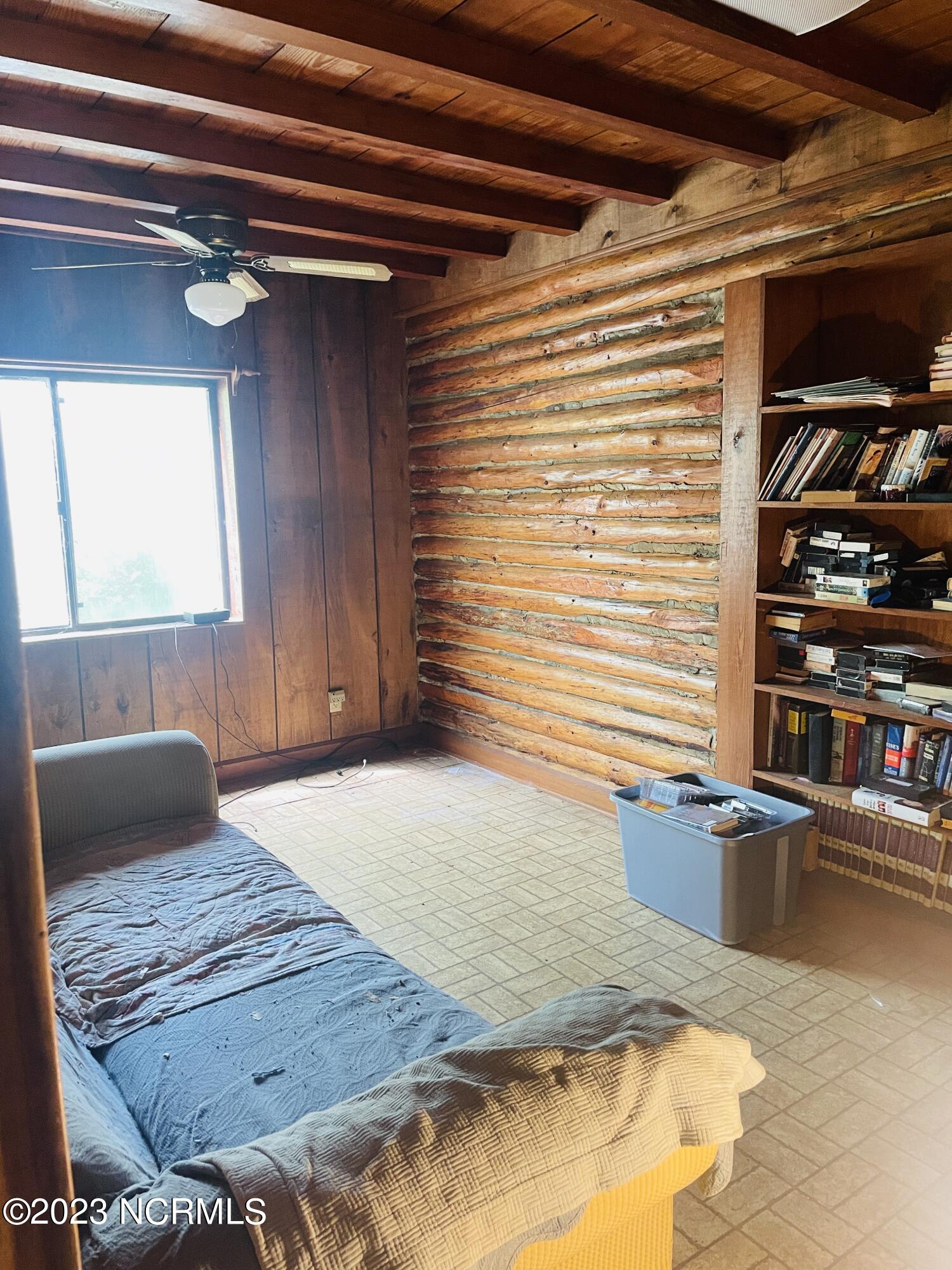 6185 Rough And Ready Road Chadbourn, NC 28431 - Photo 61 of 78 Enjoy wooden ceiling accents and a built in book shelf.