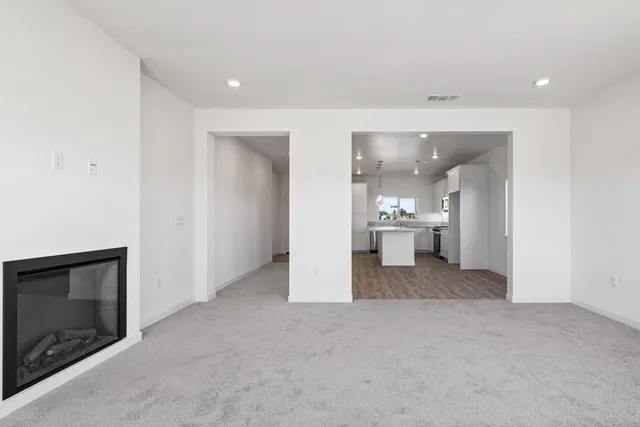 a view of a hallway with a fireplace