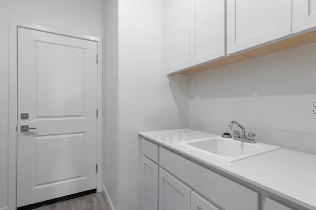 a bathroom with a sink and vanity