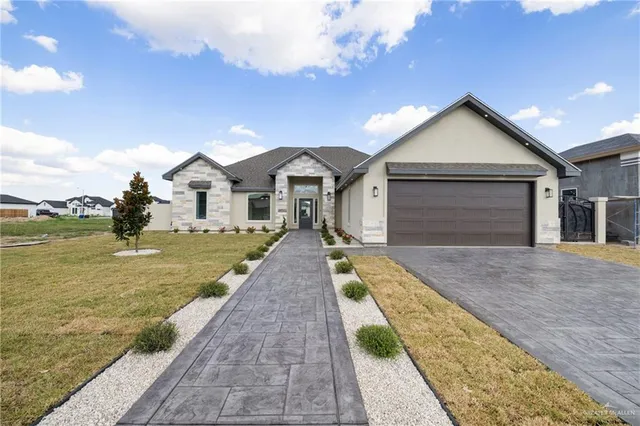 a view of a house with a swimming pool and a yard