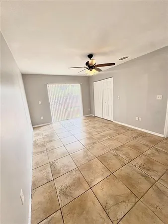a view of an empty room with a window