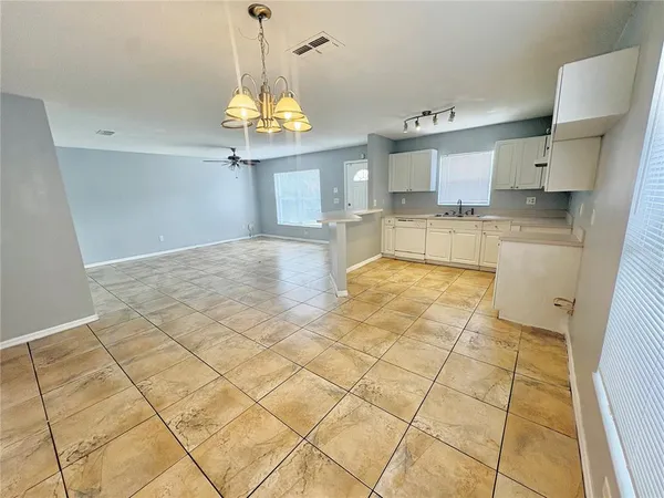 a view of a kitchen with marble kitchen and granite countertop a sink