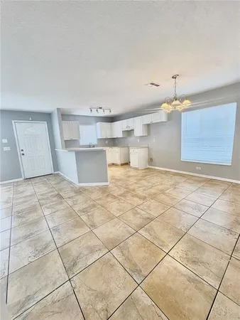 a view of a kitchen with a sink and cabinets