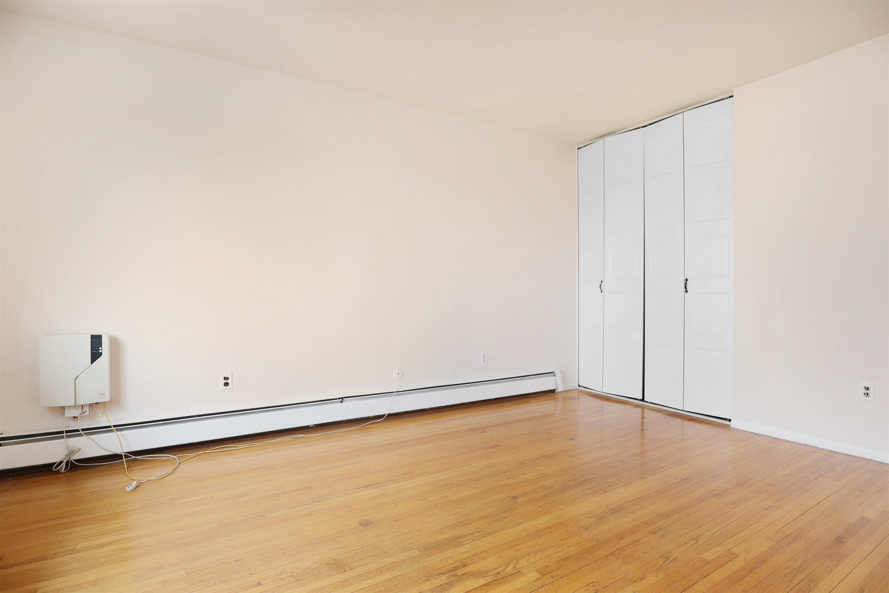 711 Bergen Street, Unit 2 Harrison, NJ 07029 - Photo 11 of 13 a view of a room with an empty space and wooden floor