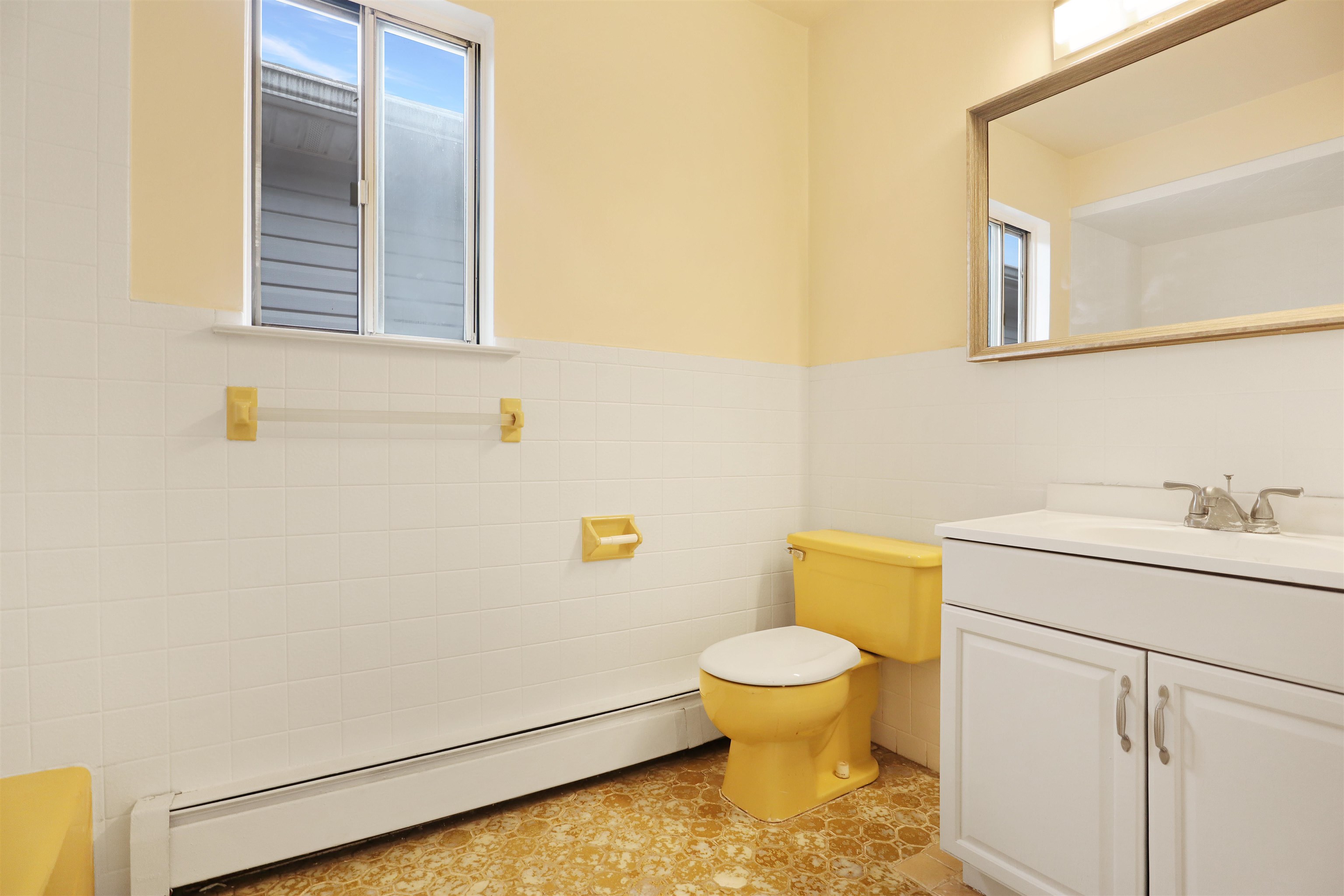 711 Bergen Street, Unit 2 Harrison, NJ 07029 - Photo 12 of 13 a bathroom with a sink and a toilet