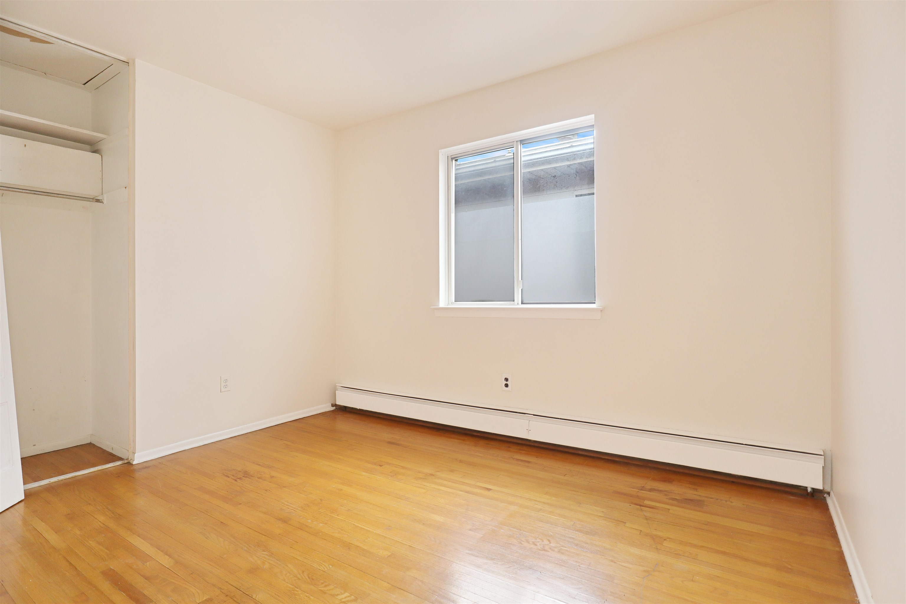 711 Bergen Street, Unit 2 Harrison, NJ 07029 - Photo 10 of 13 a view of an empty room with a window