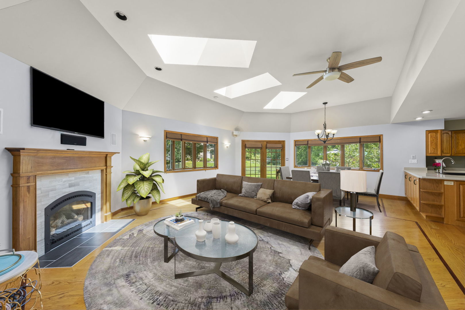 2114 Countryside Circle Naperville, IL 60565 - Photo 13 of 29 a living room with fireplace furniture and a flat screen tv