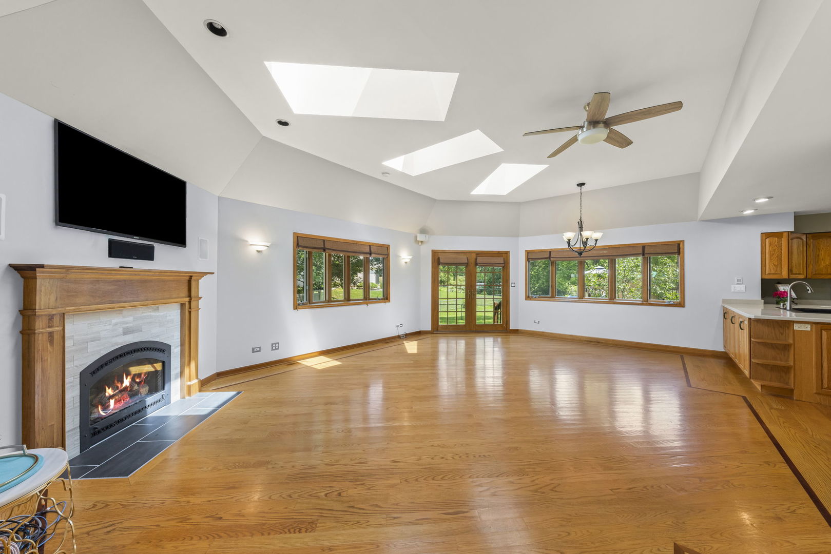 2114 Countryside Circle Naperville, IL 60565 - Photo 14 of 29 a view of an empty room with a fireplace and a window