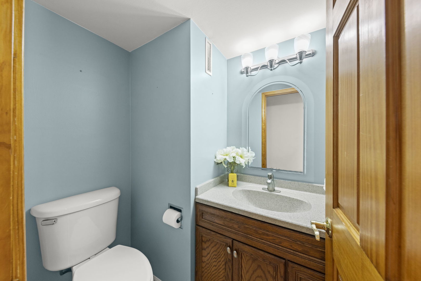 2114 Countryside Circle Naperville, IL 60565 - Photo 15 of 29 a bathroom with a granite countertop toilet sink and mirror