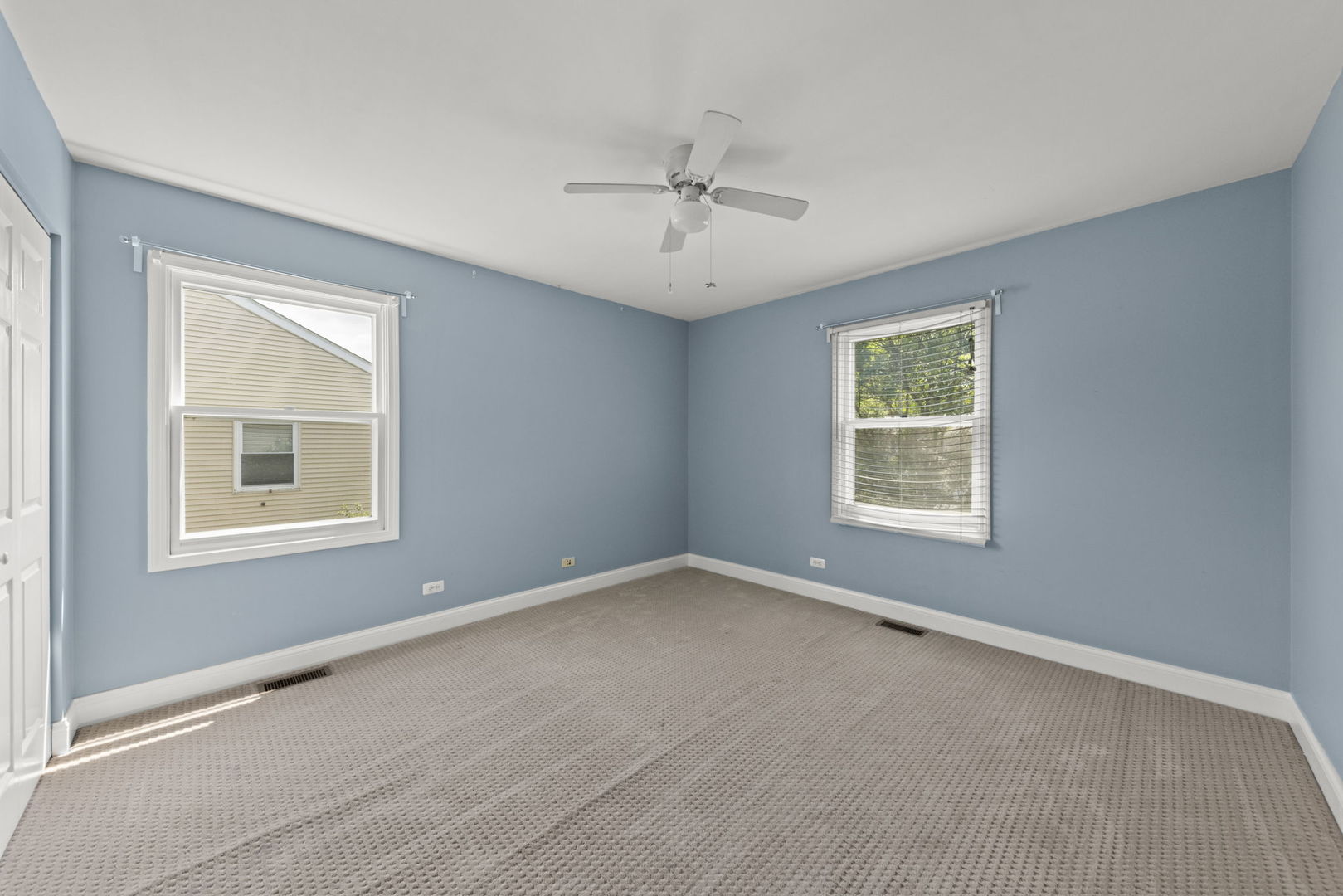 2114 Countryside Circle Naperville, IL 60565 - Photo 23 of 29 an empty room with a window and a ceiling fan