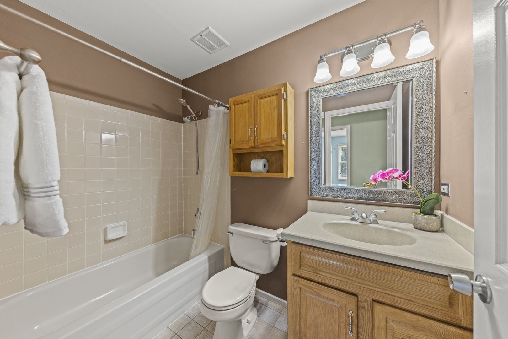 2114 Countryside Circle Naperville, IL 60565 - Photo 24 of 29 a bathroom with a sink toilet and shower