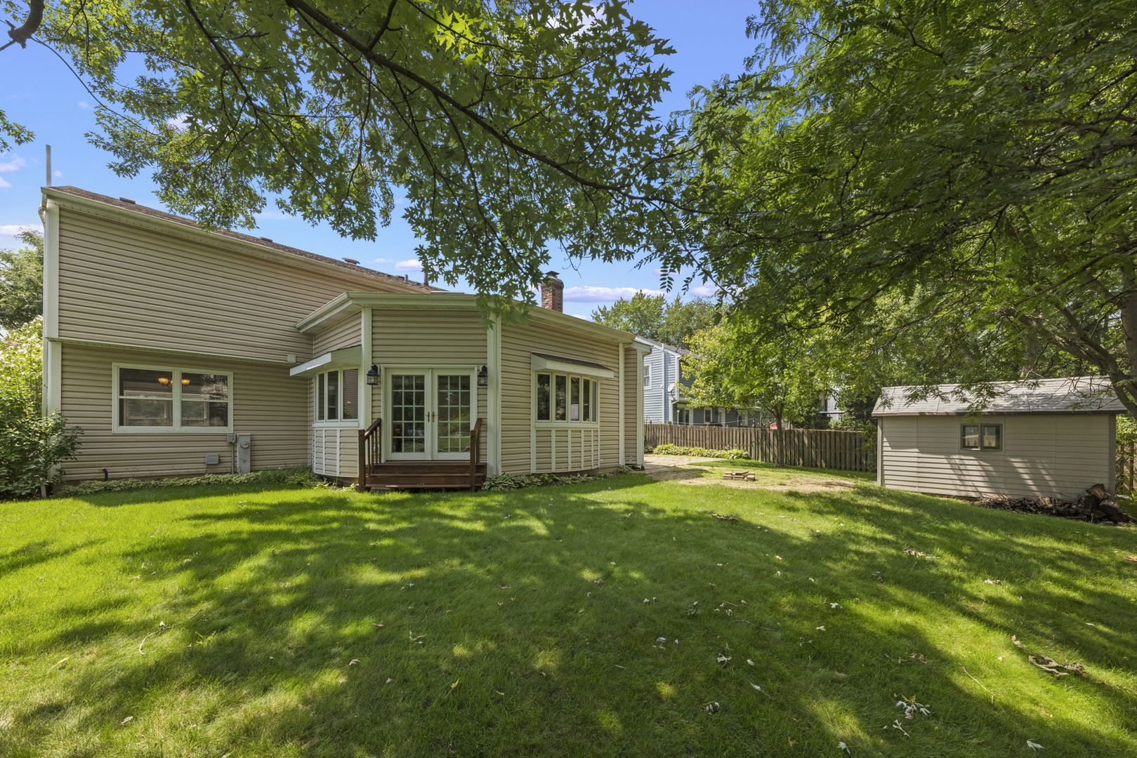 2114 Countryside Circle Naperville, IL 60565 - Photo 25 of 29 a view of a house with a yard and sitting area