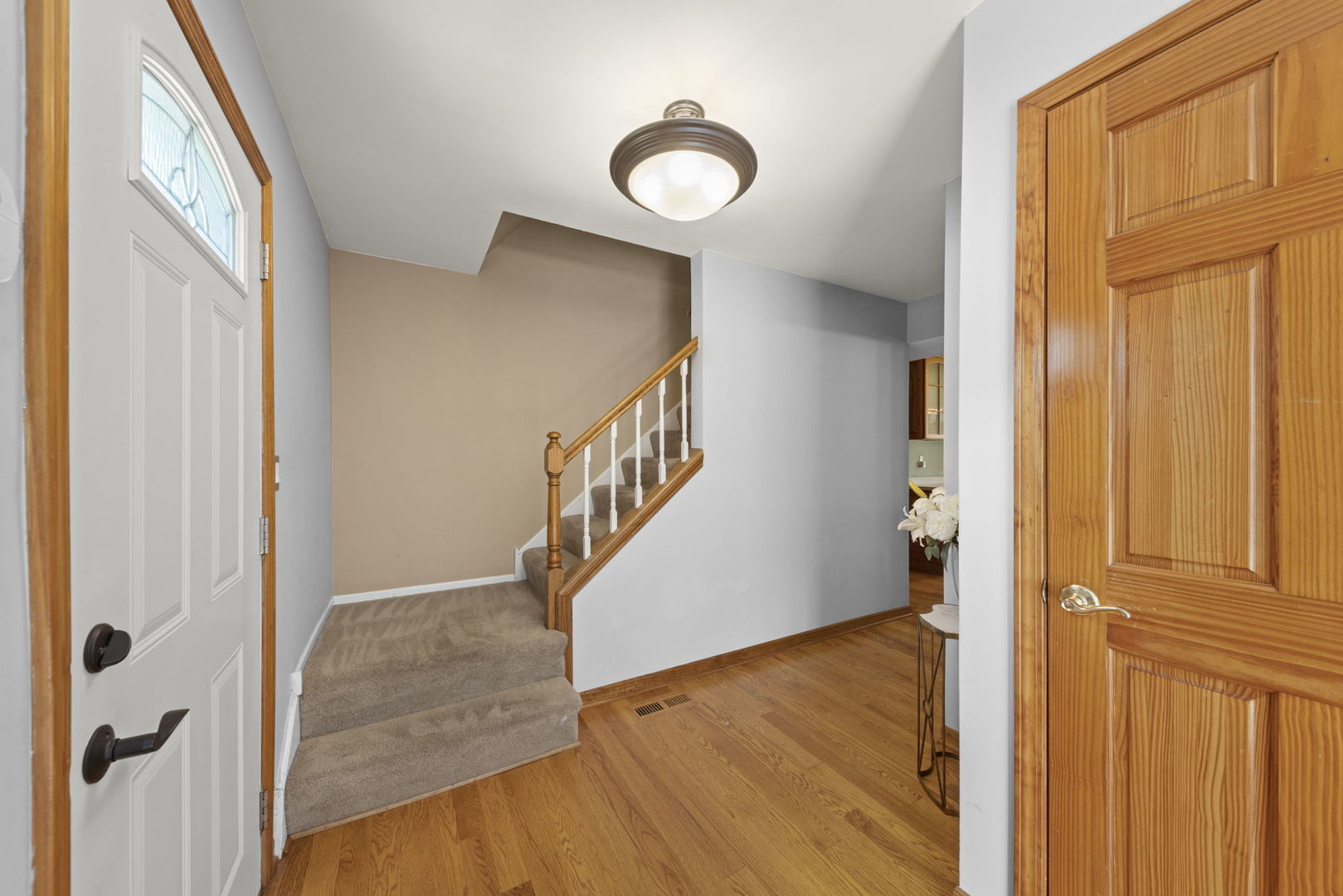 2114 Countryside Circle Naperville, IL 60565 - Photo 3 of 29 a view of a hallway with wooden floor and entryway