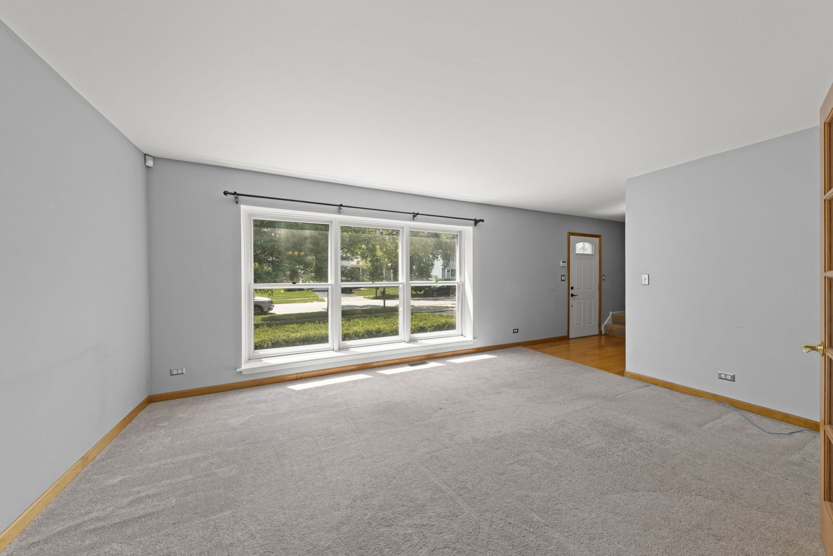 2114 Countryside Circle Naperville, IL 60565 - Photo 5 of 29 a view of an empty room with a window