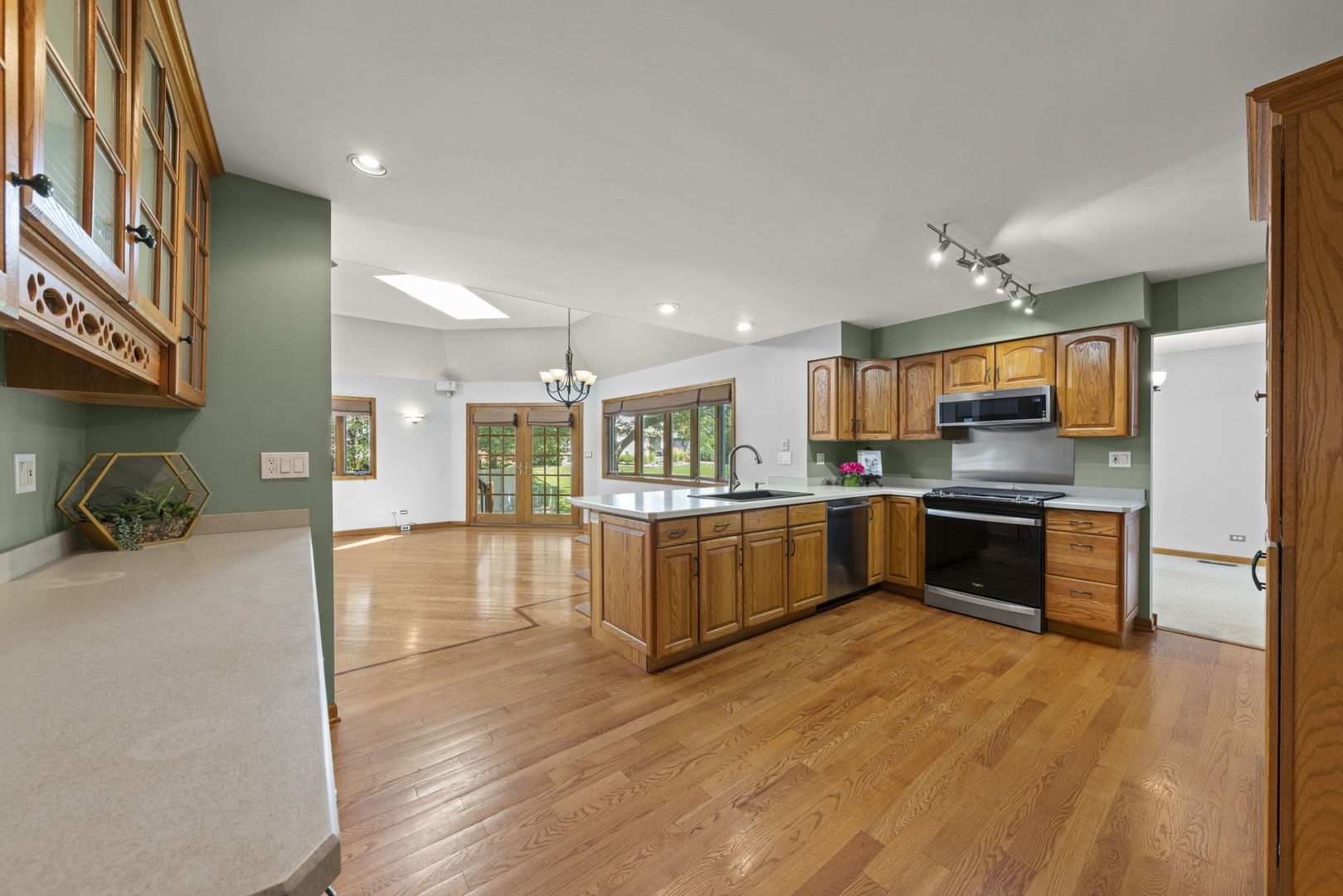 2114 Countryside Circle Naperville, IL 60565 - Photo 8 of 29 a large kitchen with stainless steel appliances granite countertop a large counter top and a stove