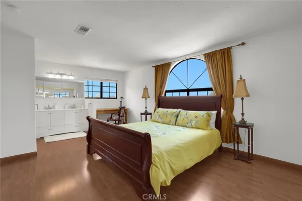a bedroom with a bed and window