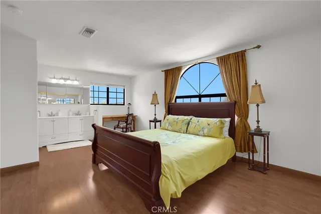 a bedroom with a bed and window