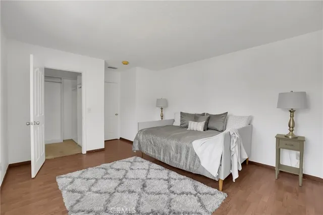 a bedroom with a bed and a table