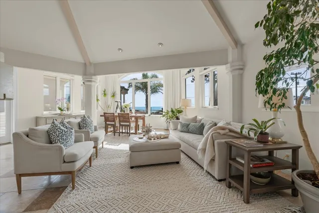 a dining room with furniture window and outside view