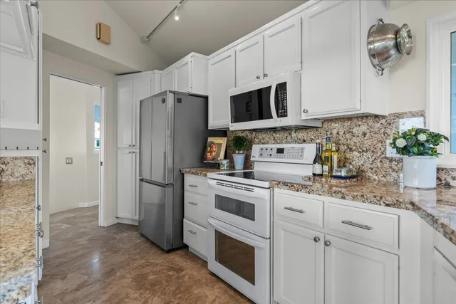 a view of a porch with furniture and floor