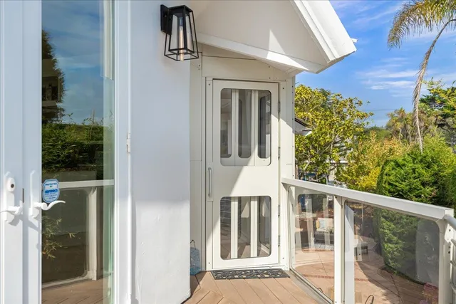a spacious bedroom with a bed and a couch