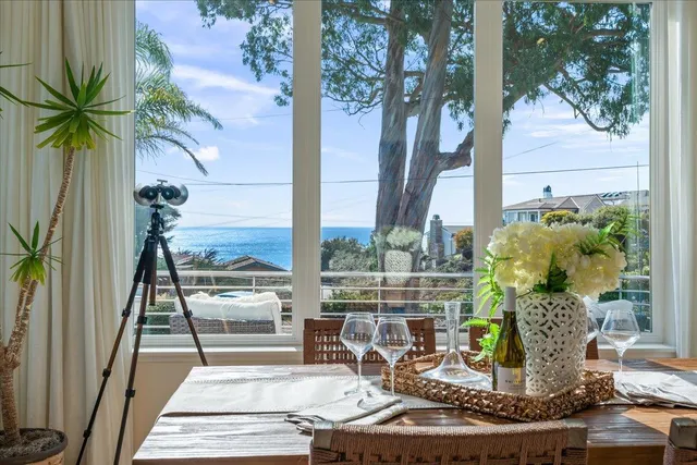 a white bath tub sitting in a bathroom next to a window