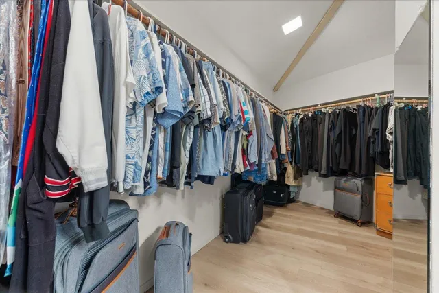 a bathroom with a sink vanity and mirror