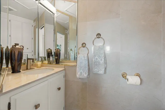 a living room with a sink and a table with potted plants