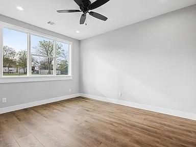 134 Crawford Road Argyle, TX 76226 - Photo 12 of 13 wooden floor in an empty room with a window