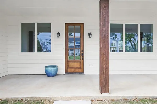 a view of a door and chair in the porch
