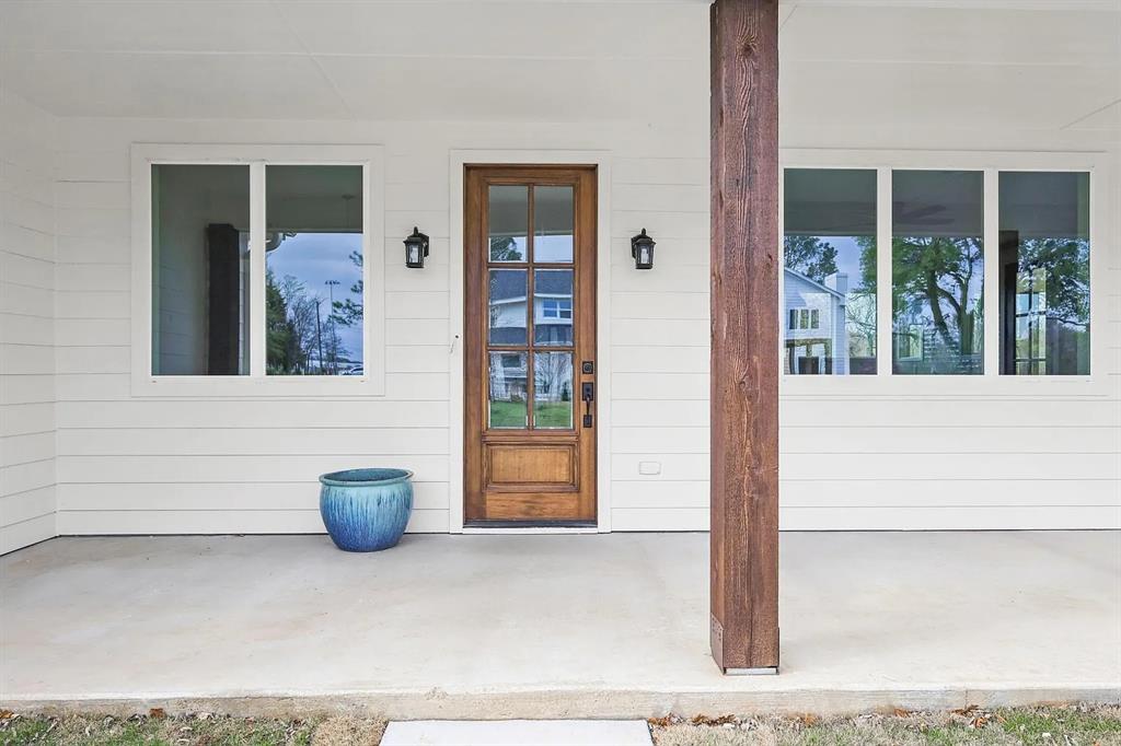 134 Crawford Road Argyle, TX 76226 - Photo 3 of 13 a view of a door and chair in the porch