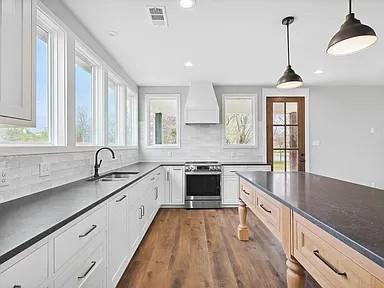 134 Crawford Road Argyle, TX 76226 - Photo 6 of 13 a kitchen with sink cabinets and window
