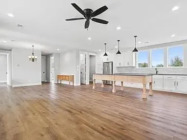 a view of kitchen with cabinets and wooden floor