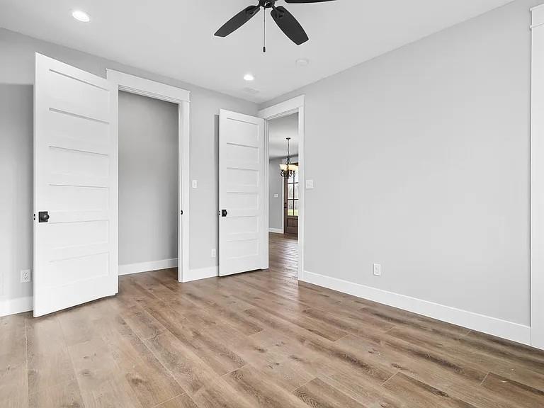 134 Crawford Road Argyle, TX 76226 - Photo 10 of 13 wooden floor in an empty room with a ceiling fan