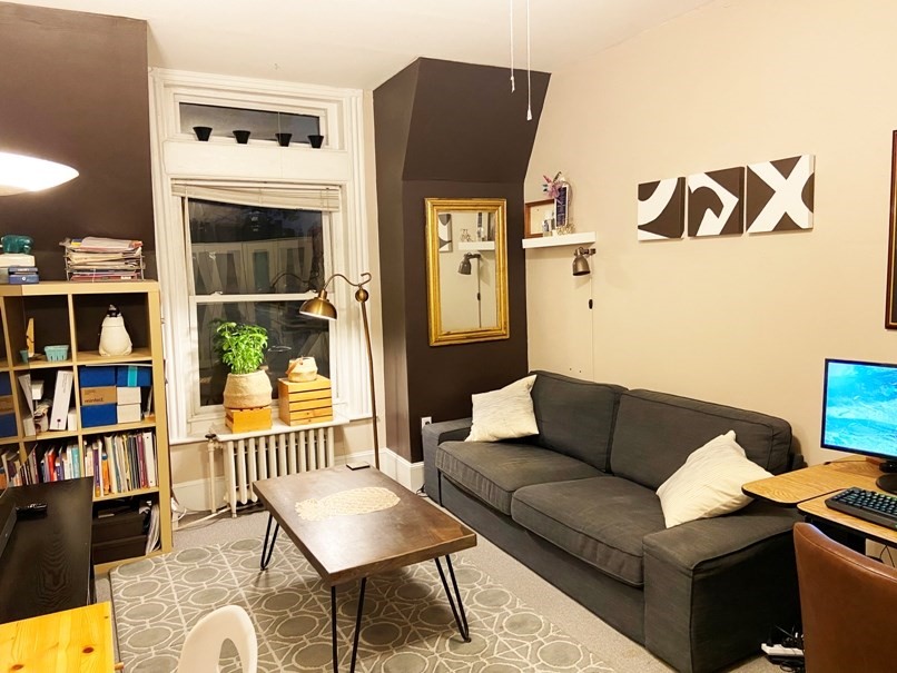 471 Commonwealth Avenue, Unit 4F Boston, MA 02215 - Photo 3 of 9 a living room with furniture and a book shelf