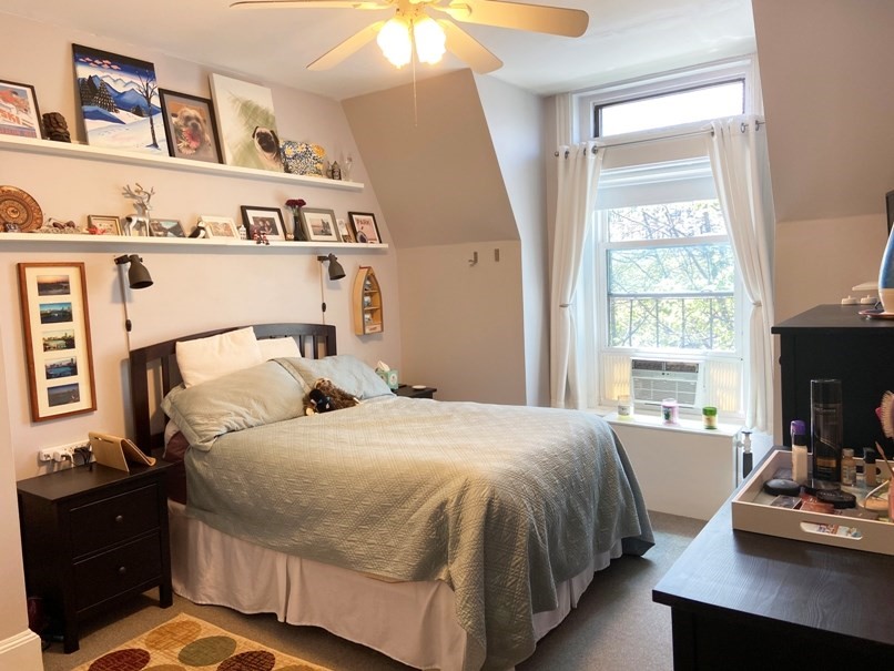 471 Commonwealth Avenue, Unit 4F Boston, MA 02215 - Photo 5 of 9 a bedroom with a bed and a window