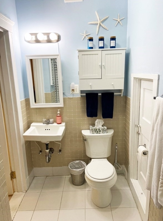 471 Commonwealth Avenue, Unit 4F Boston, MA 02215 - Photo 7 of 9 a bathroom with a sink toilet and mirror