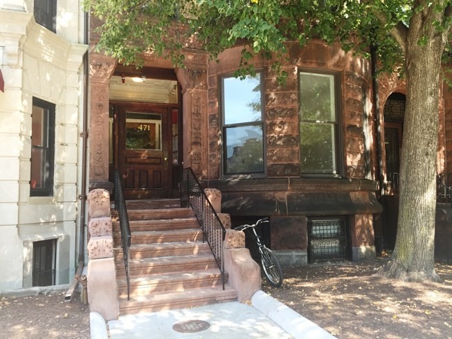 471 Commonwealth Avenue, Unit 4F Boston, MA 02215 - Photo 9 of 9 a view of a building with a door and windows