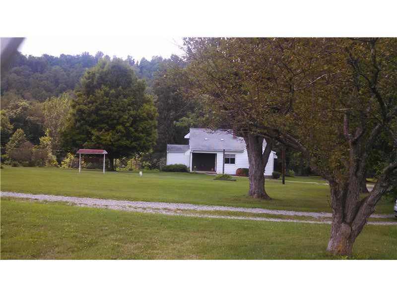 761 Lone Pine Road Amity, PA 15311 - Photo 18 of 19 Exterior Back. Pretty trees--covered back porch too.