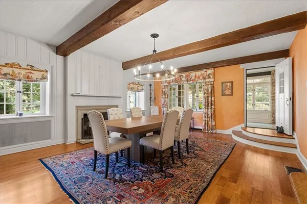 a view of a dining room with furniture window and wooden floor